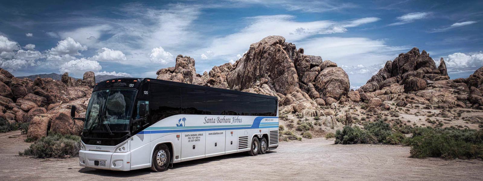 A Santa Barbara Airbus deluxe coach parked in the desert during a private charter.